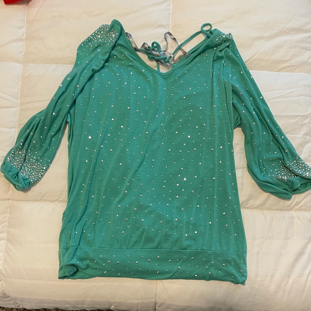 The buckle shirt, it ties up in the back.